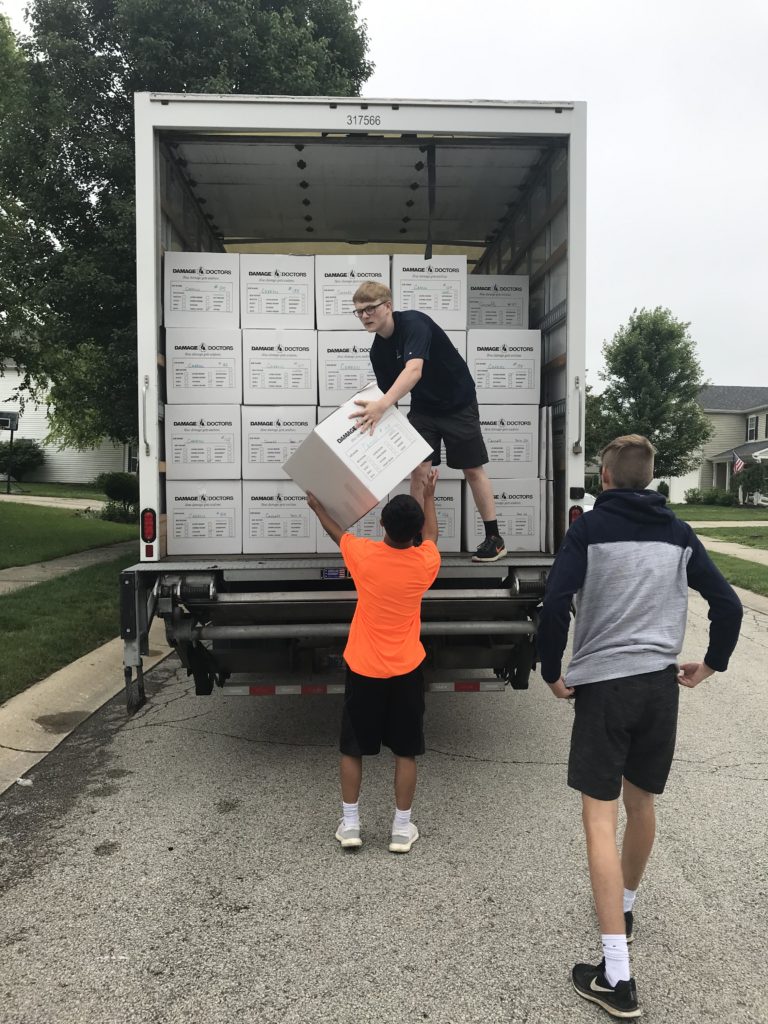 Volunteers unloading a truck